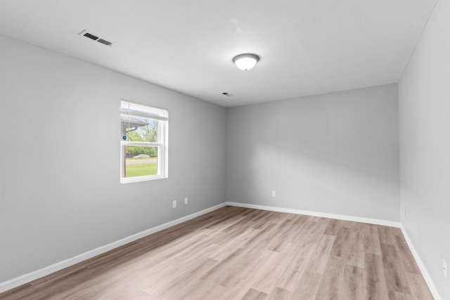 spare room with light wood-type flooring