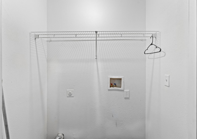 clothes washing area featuring washer hookup and hookup for an electric dryer