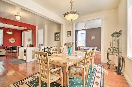 dining space featuring ceiling fan and wood-type flooring