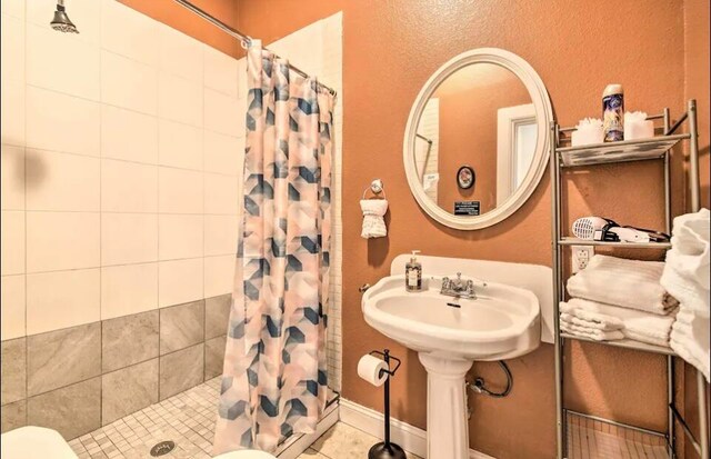 bathroom with walk in shower and toilet