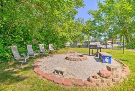 exterior space with a fire pit and a patio area