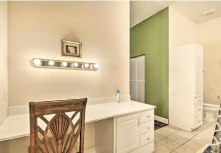 bathroom with toilet and tile patterned floors