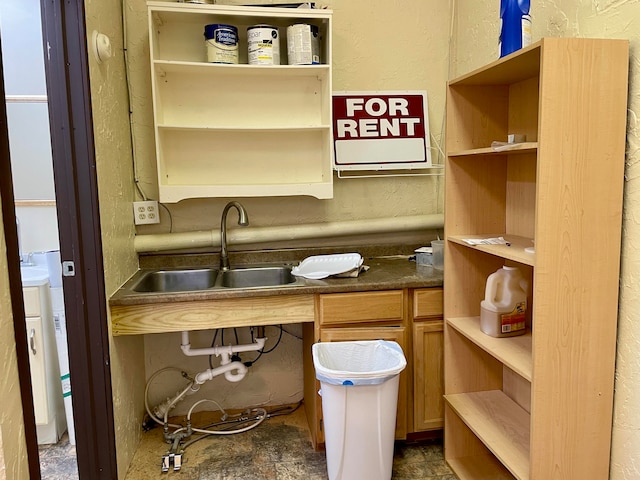 pantry featuring washer / clothes dryer and sink