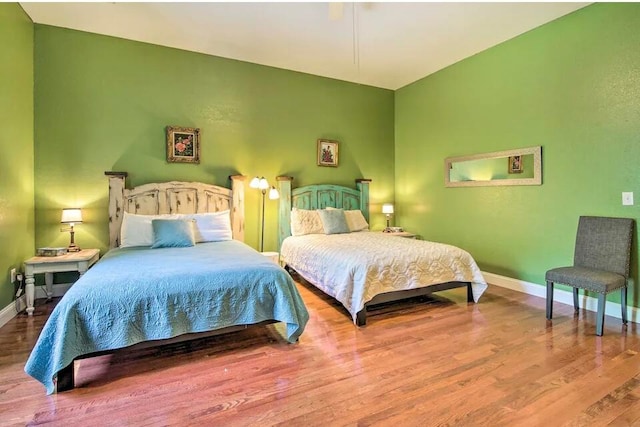 bedroom with wood-type flooring