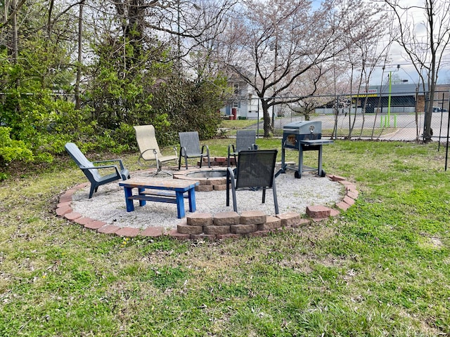 view of yard featuring an outdoor fire pit