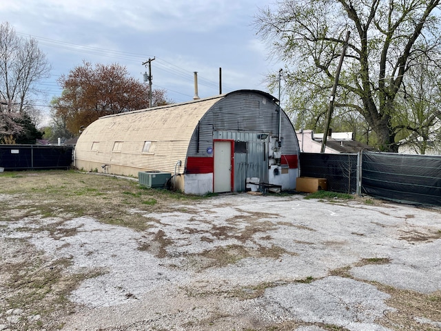 view of outbuilding featuring central AC unit