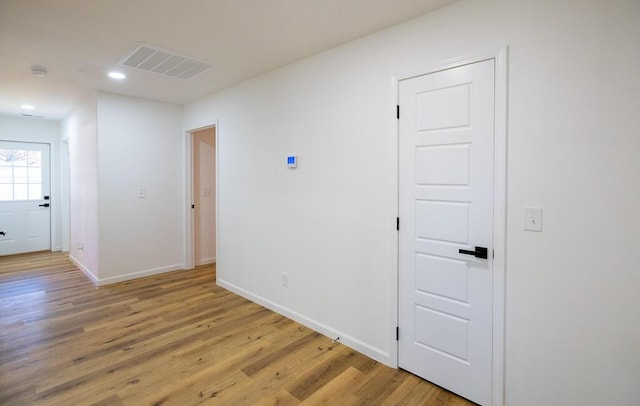 hall with light hardwood / wood-style floors