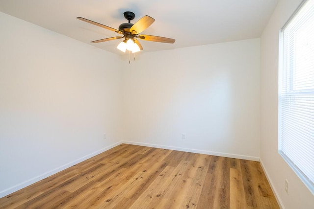 unfurnished room with ceiling fan, a healthy amount of sunlight, and light wood-type flooring