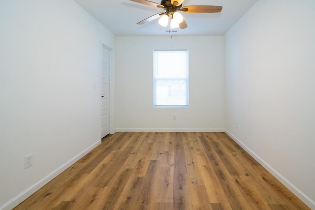 spare room with ceiling fan and light hardwood / wood-style flooring