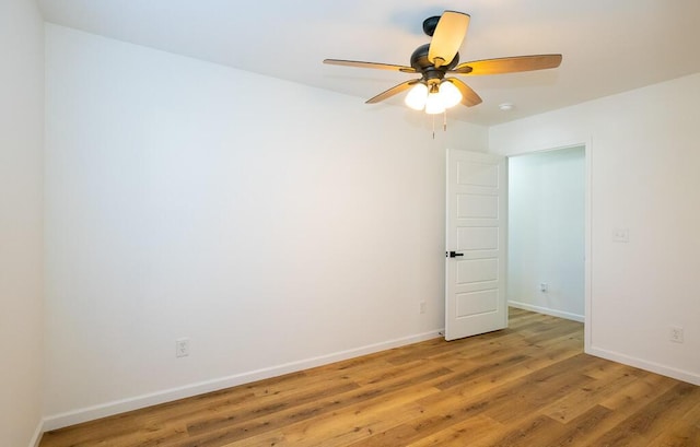 spare room featuring ceiling fan and hardwood / wood-style floors