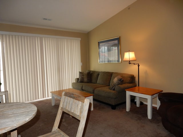 living room featuring lofted ceiling and carpet flooring