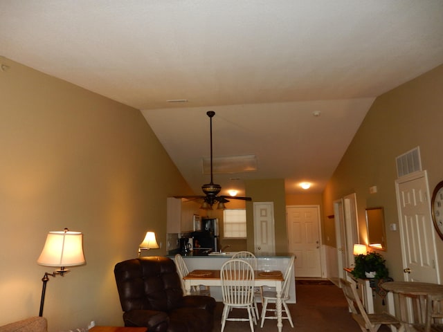 dining space with lofted ceiling and ceiling fan