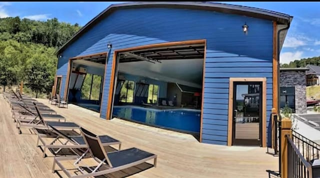 view of swimming pool with a wooden deck