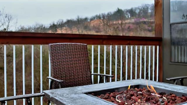 wooden deck with an outdoor fire pit