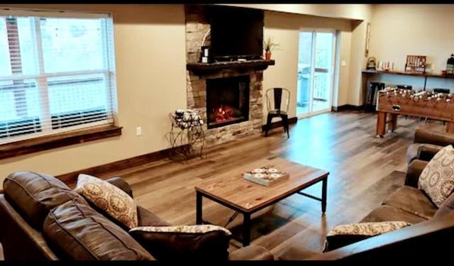 living room featuring a fireplace and hardwood / wood-style floors