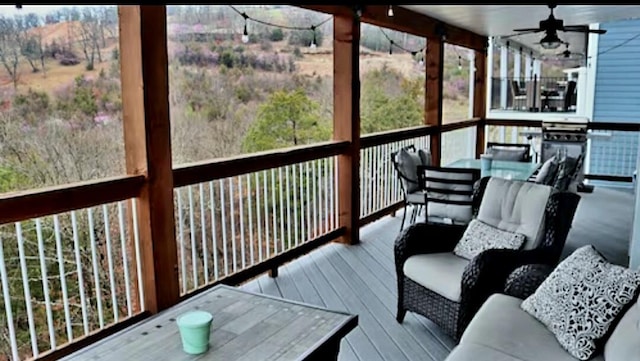 sunroom / solarium with ceiling fan