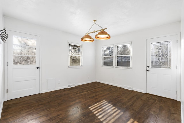 foyer with dark hardwood / wood-style flooring