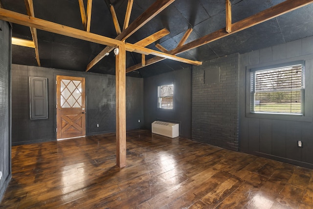 entryway featuring vaulted ceiling with beams and dark hardwood / wood-style flooring