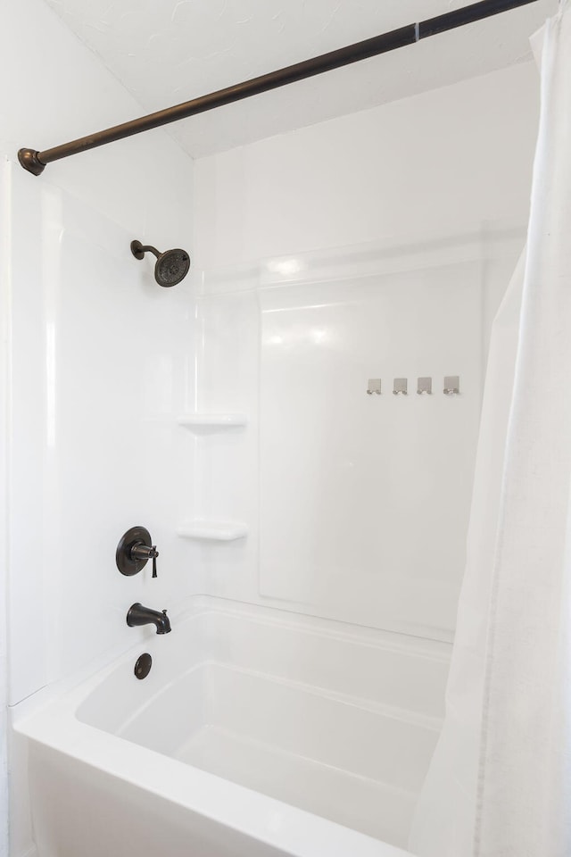 bathroom with shower / tub combo