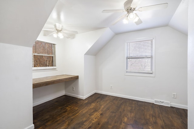 additional living space with dark wood-type flooring, ceiling fan, and vaulted ceiling