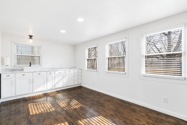 unfurnished room with dark hardwood / wood-style flooring