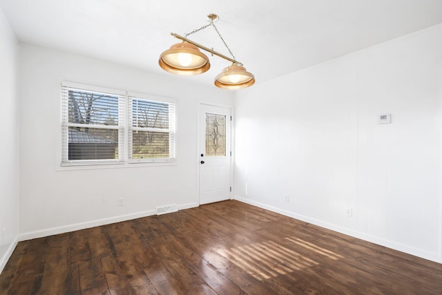 spare room with dark hardwood / wood-style floors