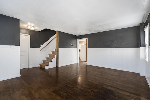 unfurnished room featuring dark hardwood / wood-style flooring