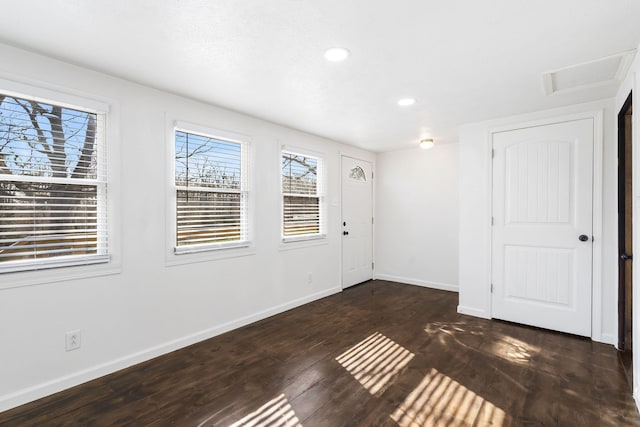 empty room featuring dark wood-type flooring