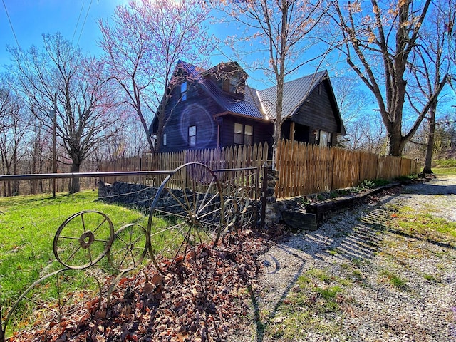 view of home's exterior featuring a lawn