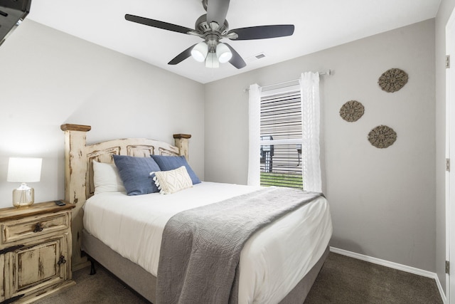 bedroom featuring dark colored carpet and ceiling fan