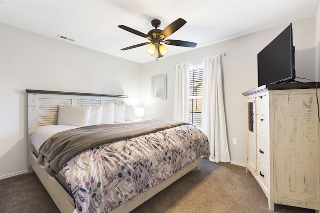 bedroom featuring ceiling fan and dark colored carpet