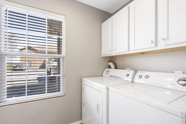 laundry area featuring cabinets and washer and clothes dryer