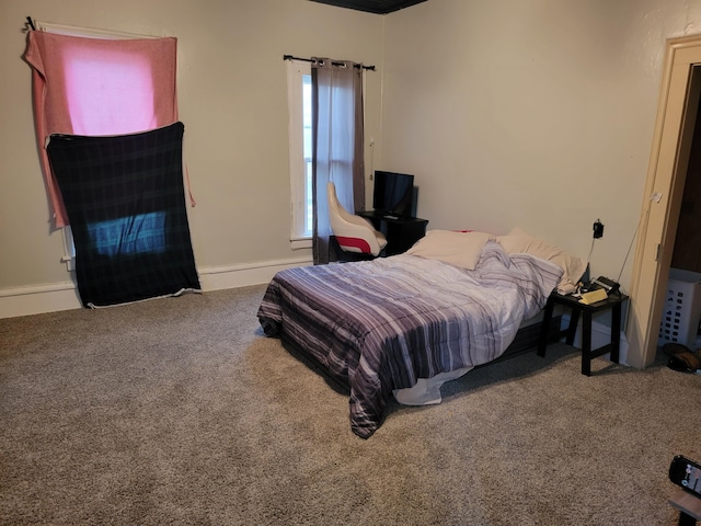 bedroom featuring carpet