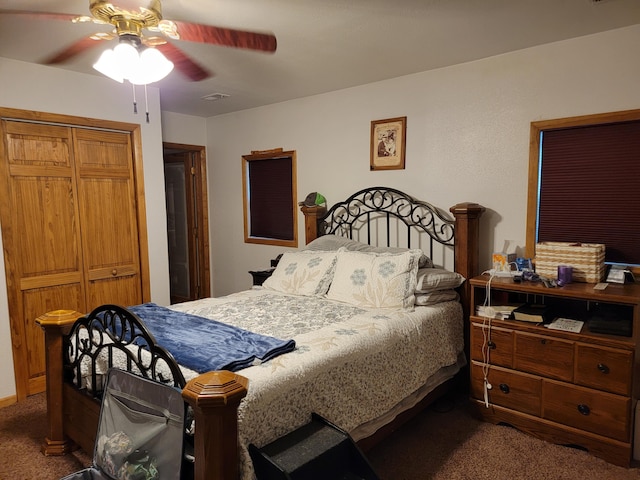 carpeted bedroom featuring ceiling fan and a closet