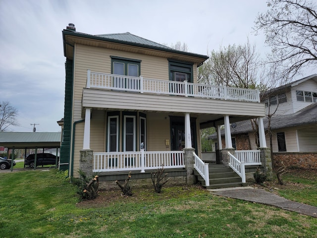 view of front of property with a front yard, a porch, and a carport