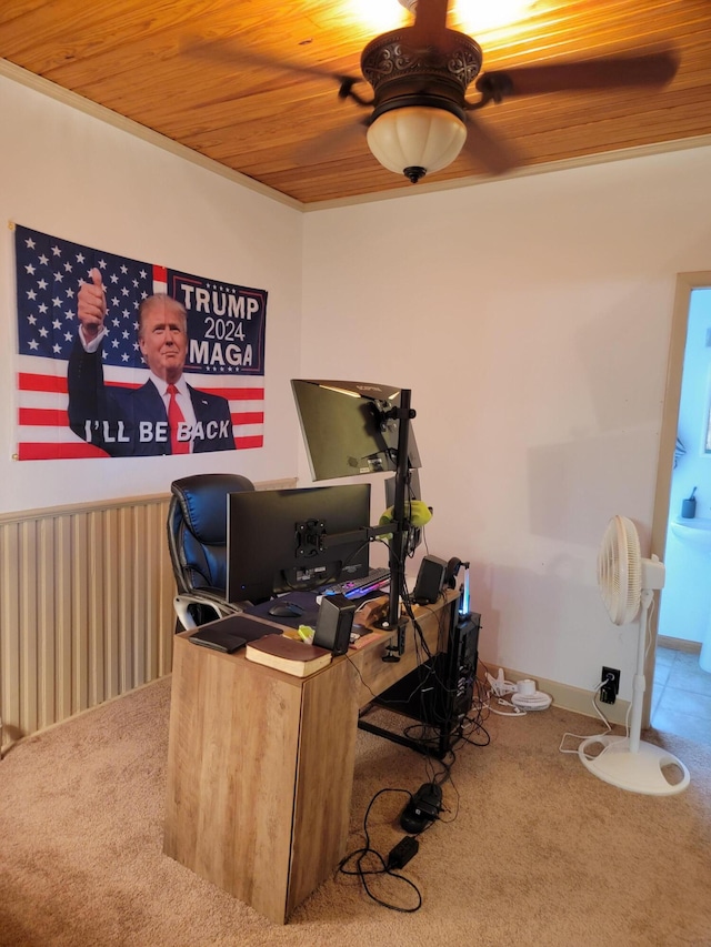 carpeted home office featuring ceiling fan and wood ceiling