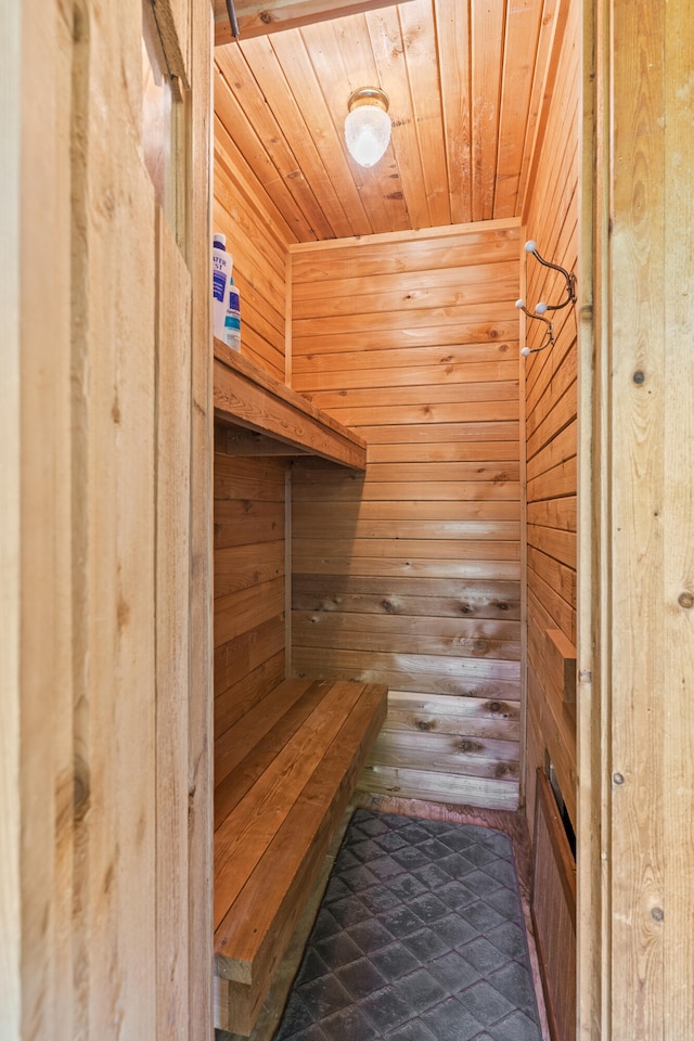 view of sauna with wood ceiling and wood walls