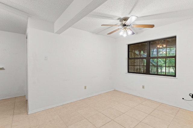 tiled spare room with ceiling fan, beam ceiling, and a textured ceiling