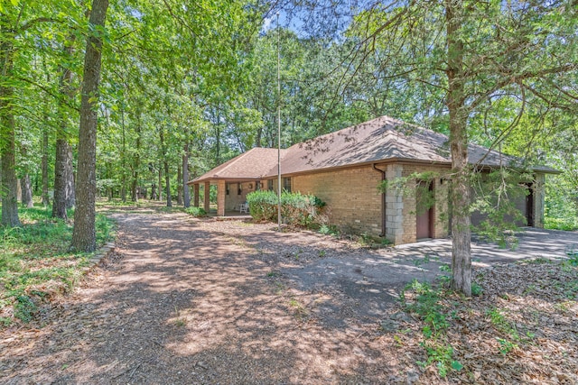 view of side of home featuring a garage