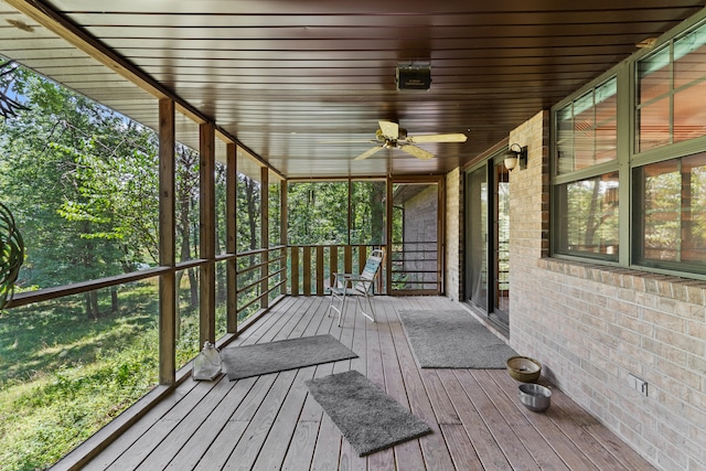 wooden terrace featuring ceiling fan