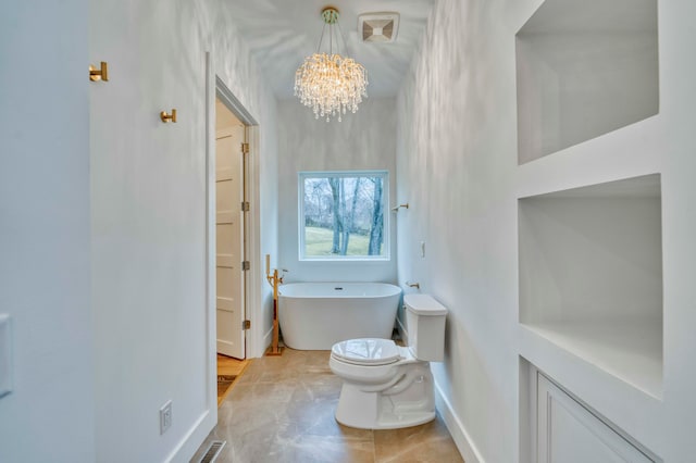 bathroom with a notable chandelier, a bathing tub, tile patterned flooring, and toilet