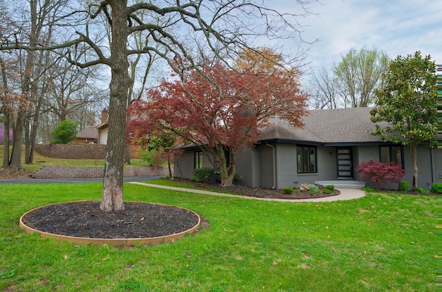 view of front of house with a front lawn