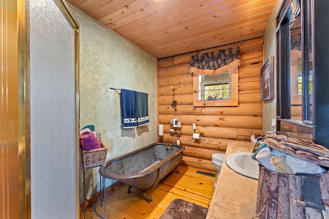 bathroom featuring a bathtub, log walls, wooden ceiling, and wood-type flooring