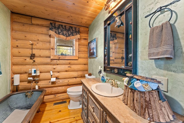 bathroom with vanity, wood-type flooring, wooden ceiling, rustic walls, and toilet