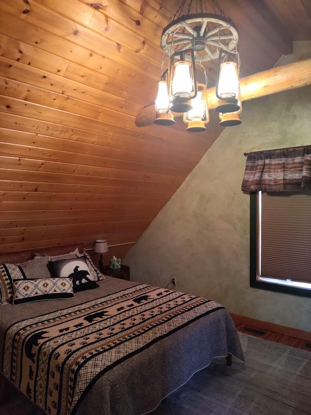 bedroom featuring vaulted ceiling with beams, an inviting chandelier, wooden ceiling, and wood-type flooring