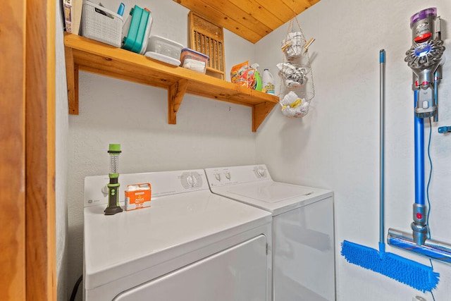 washroom featuring washer and dryer and wooden ceiling