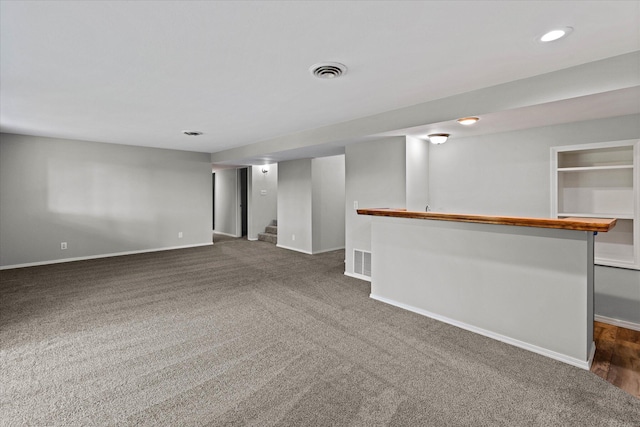 basement with dark carpet