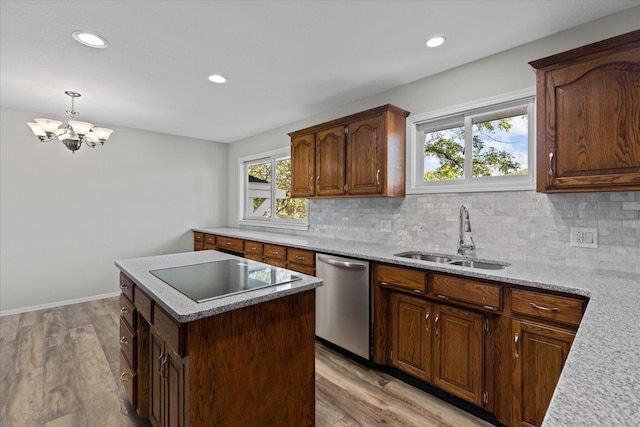 kitchen with light wood-type flooring, sink, black electric stovetop, and dishwasher