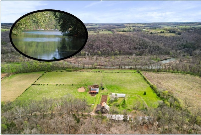 bird's eye view featuring a water view and a rural view