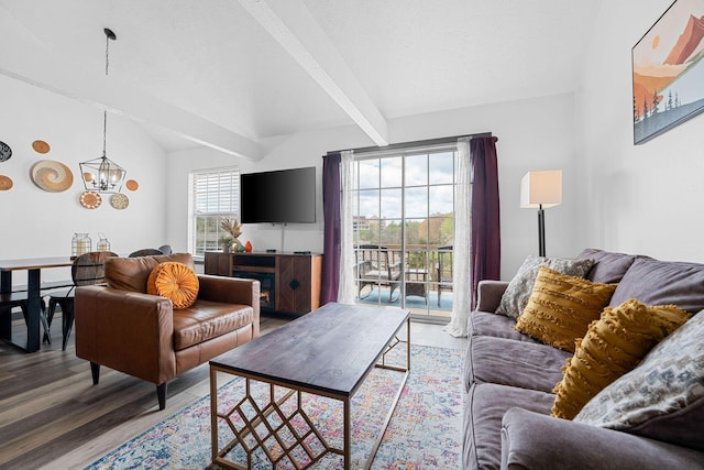 9 Scenic Ct Unit 9-9, Branson, MO 65616 - living room with wood finished floors, lofted ceiling with beams, and an inviting chandelier